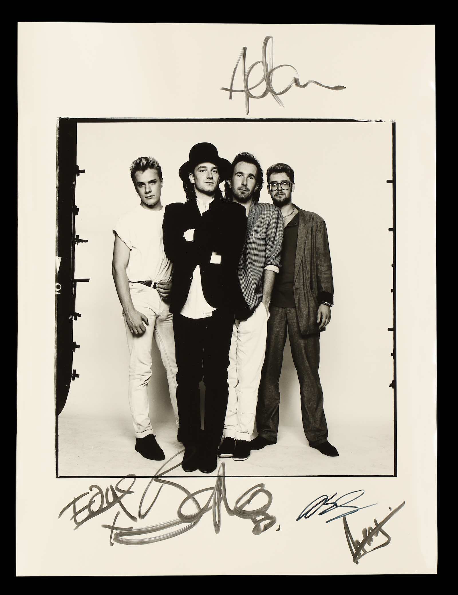 U2, signed on the front by Bono, The Edge, Adam Clayton and Larry Mullen Jr